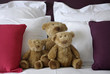 Teddy bears on a bed