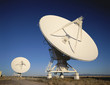 Two VLA Very Large Array radio telescope dishes facing up