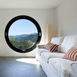 beautiful modern house in cement ,room with large porthole