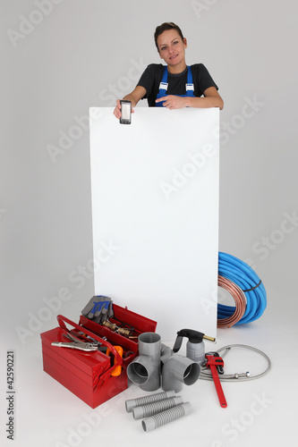 Photo: tradesman holding, mobile, phone tradesman holding, mobile, phone
