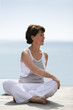 Older woman practicing yoga