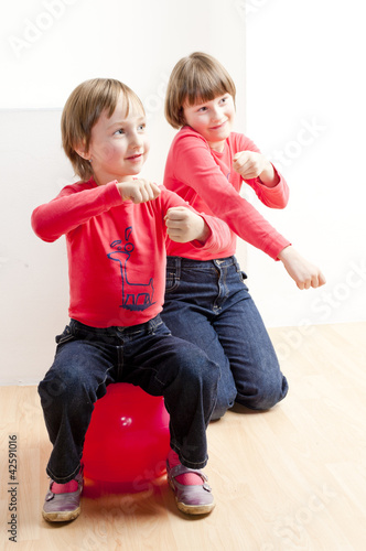Photo: two playing sisters two playing sisters