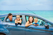 Family of four driving in a car