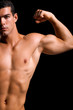 Photo : Healthy muscular young man. Isolated on black background. Healthy muscular young man. Isolated on black background.
