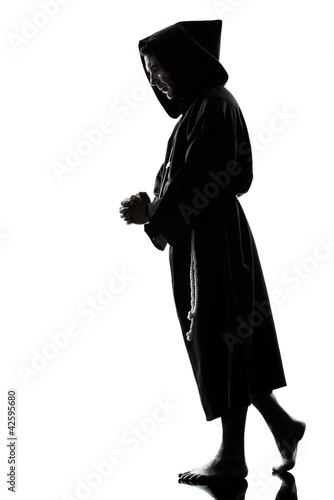Photo: man monk priest silhouette praying man monk priest silhouette praying