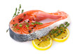 Red fish with lemon and thyme isolated on white.