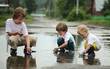three boy play in water