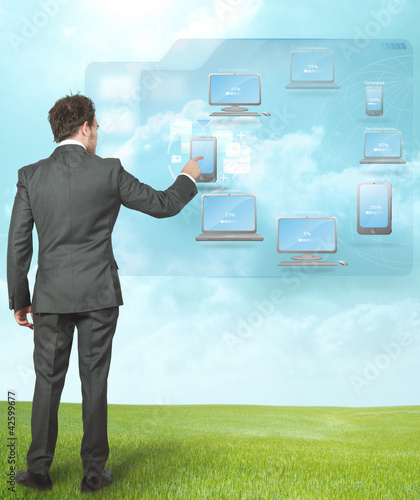 Photo: Businessman working with cloud compute Businessman working with cloud compute