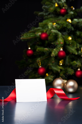 Photo: White card in elegant Christmas decoration White card in elegant Christmas decoration