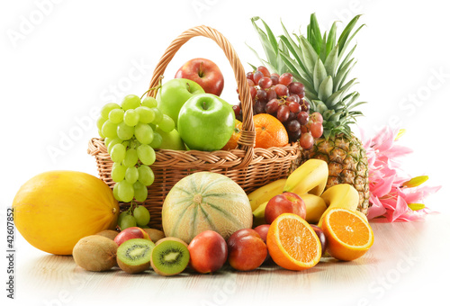 Photo: Composition with assorted fruits in wicker basket Composition with assorted fruits in wicker basket
