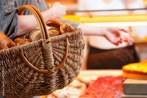 Photo: Salesperson with female customer in bakery Salesperson with female customer in bakery