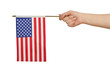 Hand holding american flag on white