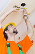Electrician working on cabling lighting