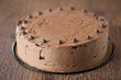 Triple chocolate cake on a wooden table