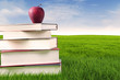 Photo: Books with apple outdoor Books with apple outdoor