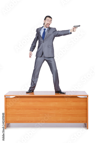 Foto: Businessman with gun on white Businessman with gun on white