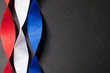 Red white and blue crepe paper on black background