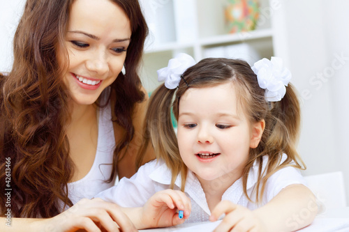 Photo: Mother and daughter studying Mother and daughter studying