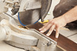 Photo: Contractor Using Circular Saw Cutting of New Laminate Flooring Contractor Using Circular Saw Cutting of New Laminate Flooring