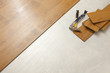 Photo: Hammer and Pry Bar with Laminate Flooring Abstract Hammer and Pry Bar with Laminate Flooring Abstract