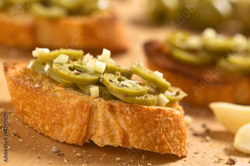 Photo: Crispy Italian antipasto, Bruschetta with olive and garlic Crispy Italian antipasto, Bruschetta with olive and garlic