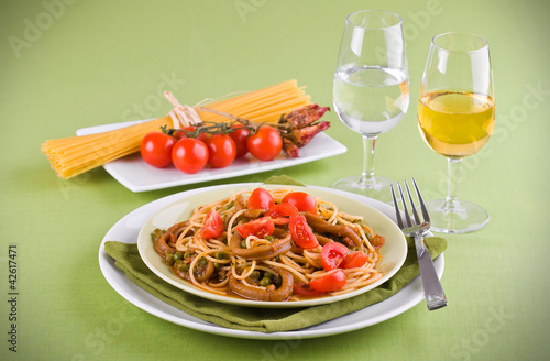 Photo: Spaghetti with squids, peas and cherry tomatoes. Spaghetti with squids, peas and cherry tomatoes.
