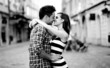 Young couple in love, hugging on the street. Selective focus.