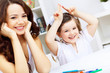 Photo: Mother and daughter studying Mother and daughter studying