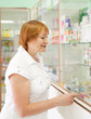 woman near counter in pharmacy