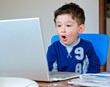 surprised baby using laptop
