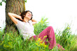 Photo: Beautiful Young Woman Relaxing outdoors. Nature Beautiful Young Woman Relaxing outdoors. Nature