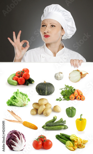 Photo: Female chef with vegetable collection Female chef with vegetable collection