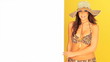 Young girl in a bikini holding a board