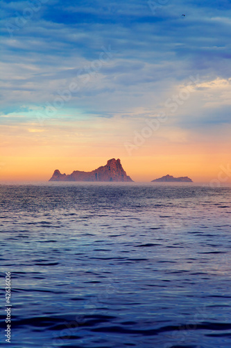 Photo: Ibiza sunset in Balearic islands view from sea Ibiza sunset in Balearic islands view from sea