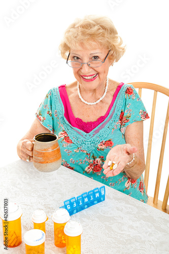 Photo: Smiling Senior Woman Takes Medicine Smiling Senior Woman Takes Medicine