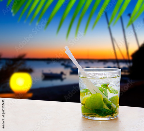 Photo: Cocktail Mojito in Balearic island sunset Cocktail Mojito in Balearic island sunset