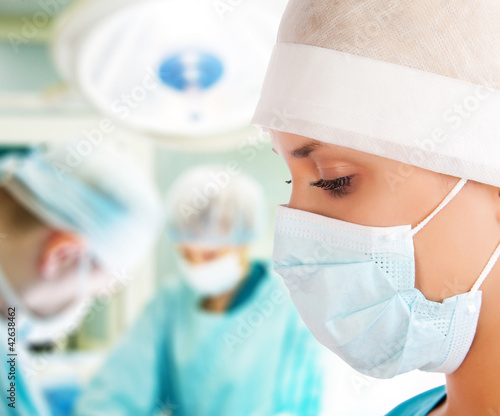 Photo: young female surgeon in operation room young female surgeon in operation room