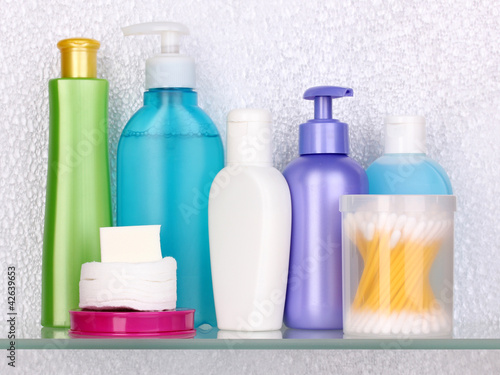 Photo: Shelf with cosmetics and toiletries in bathroom Shelf with cosmetics and toiletries in bathroom