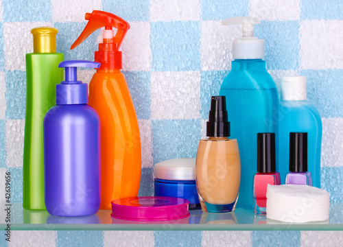 Photo: Shelf with cosmetics and toiletries in bathroom Shelf with cosmetics and toiletries in bathroom