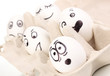White eggs with funny faces