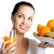 Foto: Girl with fruits and glass of orange juice, on white Girl with fruits and glass of orange juice, on white