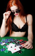 Sexy girl playing poker