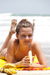 beautiful girl sunbathes on a tropical beach