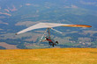 Hang glider pilot in Italian mountains