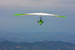 Hang glider pilot in Italian mountains