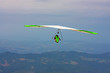 Hang glider pilot in Italian mountains