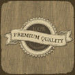 Vintage label with premium quality text on wooden texture.  Vect