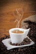 cup of hot coffee with beans -tazzina di caffè caldo con chicch