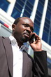 Young african businessman, talking mobile phone