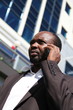 Young african businessman, talking mobile phone